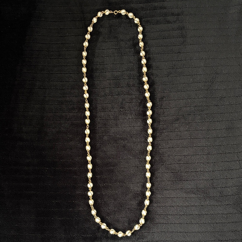 Vintage necklace w white beads wrapped in gold plated curvy design 37” length